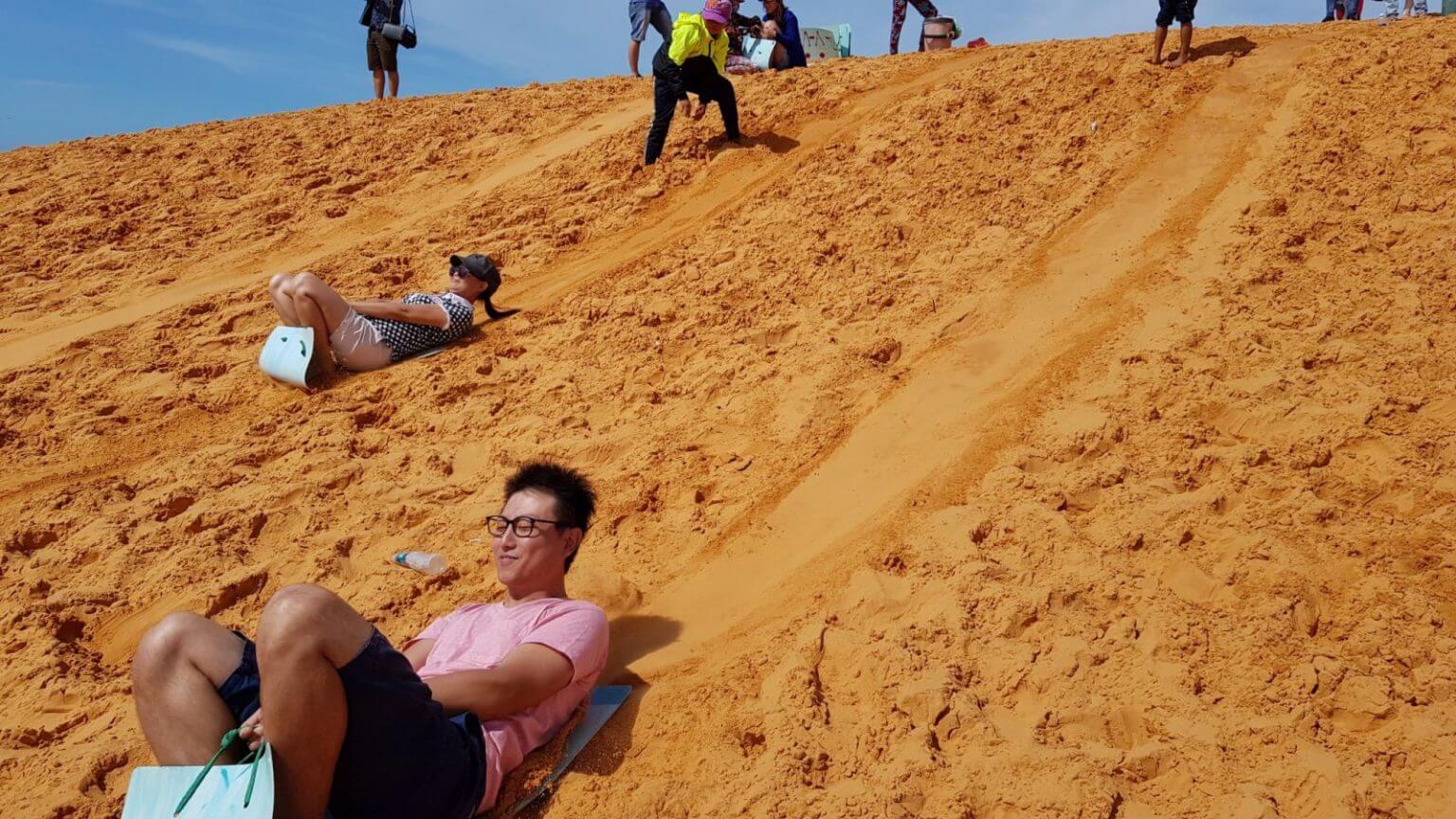 Fly down the fiery dunes on a sandboard